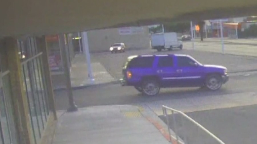 Surveillance video captured this bright purple SUV driving away from the fire._180978