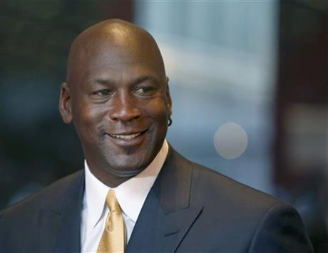 FILE - In this Aug. 21, 2015, file photo, former NBA star Michael Jordan smiles at reporters in Chicago. Nike is opening a Michael Jordan-only _256273